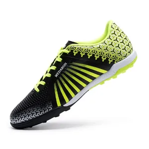 Professional men's and youth TF turf soccer shoes with black and lime green design