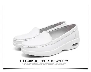 Comfortable white leather nurse shoes featuring air cushion wedge sole and fine stitching