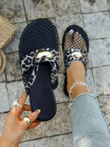 Detailed close-up showing leopard print and mesh texture of breathable flat slippers
