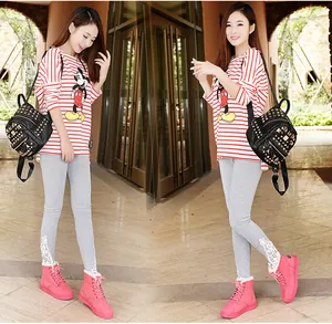 Bright pink lace-up winter boots with warm fleece lining shown on a model in outdoor setting