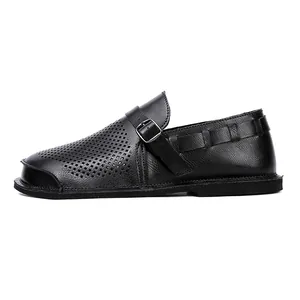 Detail view of black vintage barefoot leather shoe showing side profile and buckle strap