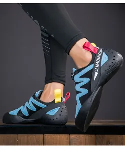 Close-up action shot of a youth wearing blue professional climbing shoes with a rotary buckle closure.