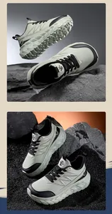 Detail view of men's wide toe sports shoes with chunky textured soles on a rocky background.