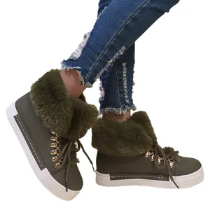 Stylish olive green women's winter snow boots with plush faux fur trim and flat soles.