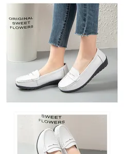 Close-up view of comfortable white leather loafers for women with durable slip-resistant soles