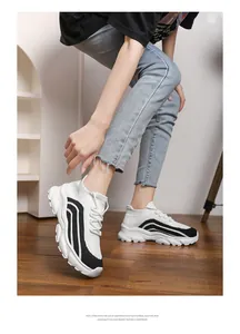 Breathable knitted chunky sneakers for women in a stylish black and white design