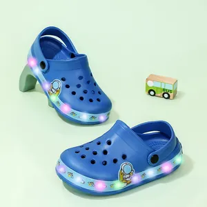 Blue children's LED light-up clogs sandals featuring a cute astronaut pattern for kids