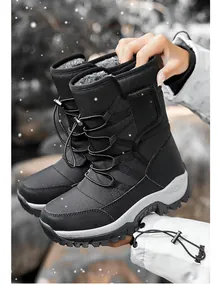 Detail shot of black winter snow boots with warm fleece lining and anti-slip sole