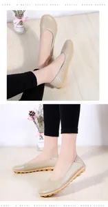 Detailed view of women's beige cowhide leather loafers with non-slip soft rubber sole