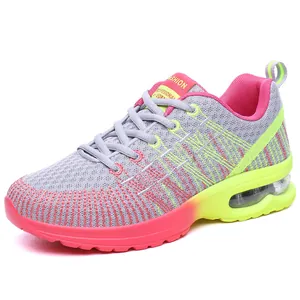 Grey and pink women's athletic running shoes with breathable mesh and air cushion sole.