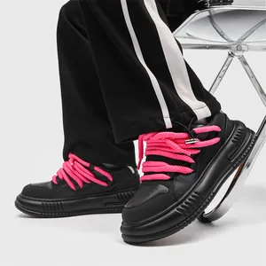 Retro black platform sneakers featuring unique pink chunky rope laces for a street style look