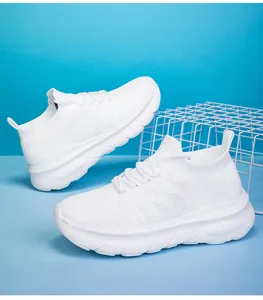 Detail of breathable white fly-knit sock sneakers with thick cushioned soles for casual wear