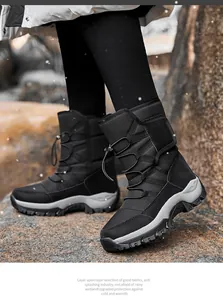Detail shot of black winter snow boots with anti-slip soles and warm fleece lining