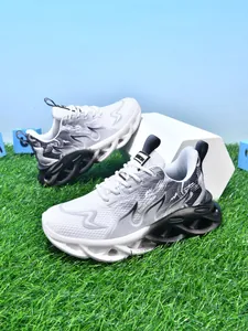Detailed side view of children's lightweight sneakers with wavy shock-absorbing soles