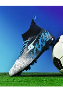Side detail of youth AG soccer cleats with blue flame pattern and high-top sock