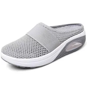 Close-up of grey breathable mesh mule with thick white platform sole and air cushion.