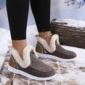 Cozy women's winter snow boots featuring warm faux fur lining in a snowy setting
