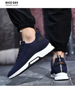 Close-up detail view of navy blue mesh elevator sneakers for men with white platform soles