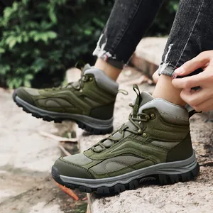 Durable olive green mid-top hiking boots for outdoor trekking and mountaineering activities.