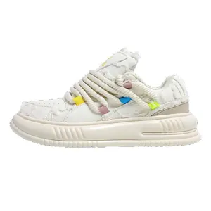 Japanese style retro white sneakers with dreadlock rope laces and canvas fringe detail.