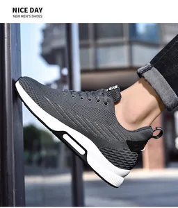 Close-up of grey mesh running shoe during walking action in outdoor street