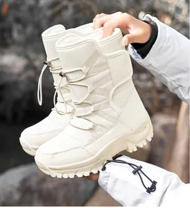 Detail view of white thermal winter snow boots with drawstring and rugged anti-slip sole.