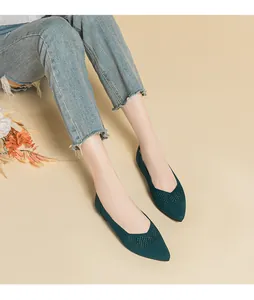 Detailed view of dark green breathable hollow knit pointed-toe flat shoes for women