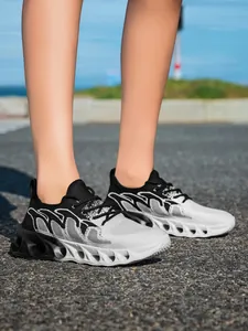 Close-up of men's fly-knit running shoes with black and white gradient design