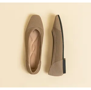 Detail showing the breathable mesh texture and square toe of beige knit flat shoes