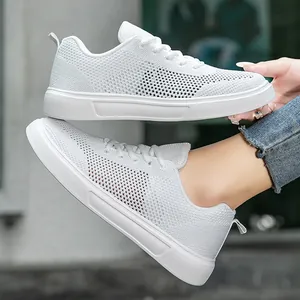 Breathable white flyknit running sneakers with soft soles for casual wear men and women