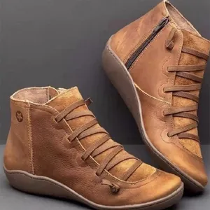 Women's vintage brown leather ankle boots with side zipper and decorative cross lacing