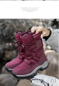 Detailed view of burgundy winter snow boots with warm plush lining and non-slip sole.