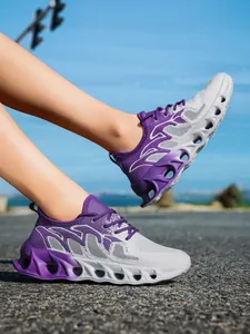 Side view of lightweight purple and grey mesh running shoes on an asphalt road