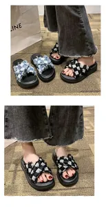 Detailed view of women's platform sandals with black and white checkered cross-straps