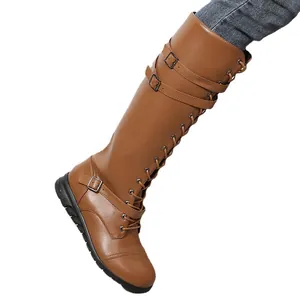 Brown knee-high lace-up boots with buckle straps and round toe for women