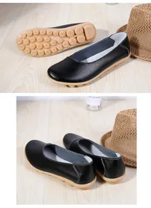 Detail view of comfortable black leather loafers with soft rubber knobby soles for women