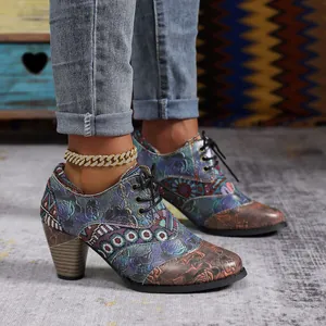 Vibrant bohemian ethnic style print chunky heel ankle boots with a pointed toe design