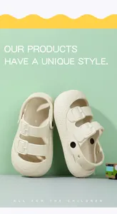 Detailed view of cream-colored children's closed-toe sandals with double buckle straps