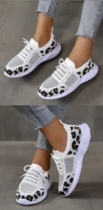 Detailed view of white flyknit walking shoes with leopard print accents on the heel