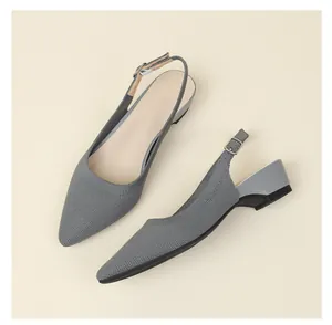 Detail view of grey breathable knitted pointed-toe slingback shoes with low block heel