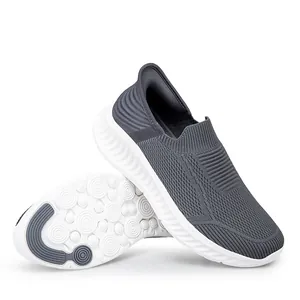 Comfortable grey slip-on walking shoes for men and women featuring breathable knit mesh uppers