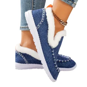 Women's blue denim snow boots with warm white faux fur lining and non-slip flat sole