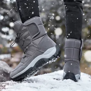 Warm grey outdoor winter snow boots with thick fleece lining walking on fresh snow