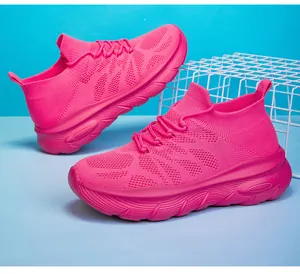 Close-up of vibrant pink breathable knit sock sneakers with comfortable thick sole