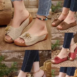 Elegant women's platform wedge sandals with floral accents and laser-cut peep toe design.