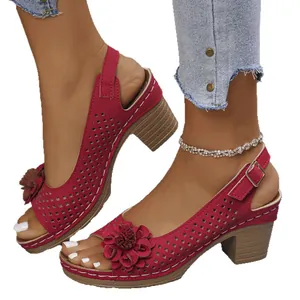 Women's burgundy chunky heel sandals with hollow-out pattern and decorative floral accent
