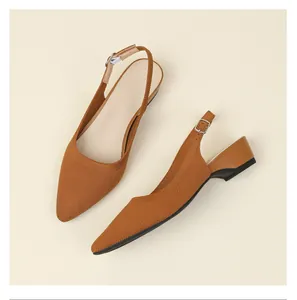 Close-up of brown knitted breathable pointed toe slingback pumps with block heel