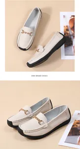 Comfortable beige loafers for women with soft sole and elegant gold chain detail.