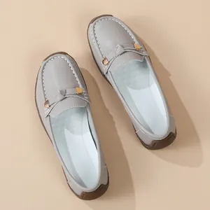 Detailed top view of grey casual loafers with soft soles and slip-on design for women