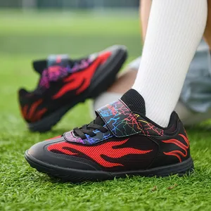 Children's breathable mesh soccer shoes with red flame design and durable turf cleats